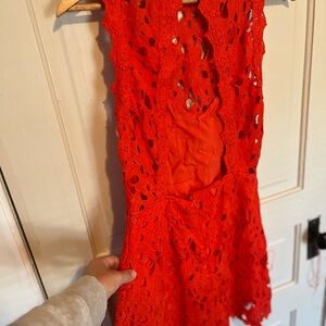 This is an ASTR romper it’s bright Red size L fits a 4/6